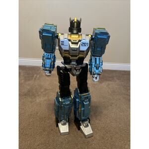 Sam's West Inc. Member's Mark Transforming Goldtone To Blue Robot Action Figure